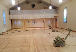 Sanctuary Floor is repaired and sanded