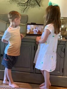 Children watching the Children's Sermon at home during the Covid-19 pandemic